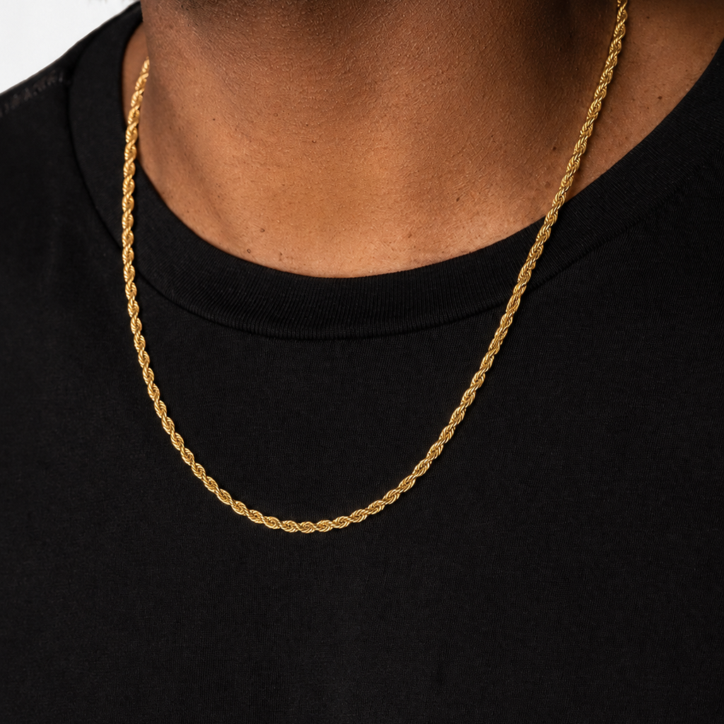 Gold 4mm rope chain necklace on a person wearing a black shirt